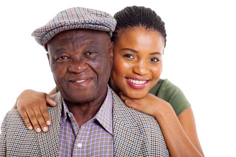 Dad and daughter smiling